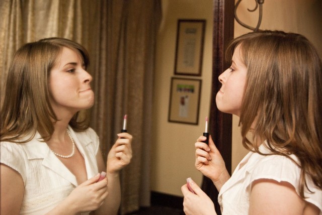 Applying lipstick for wedding