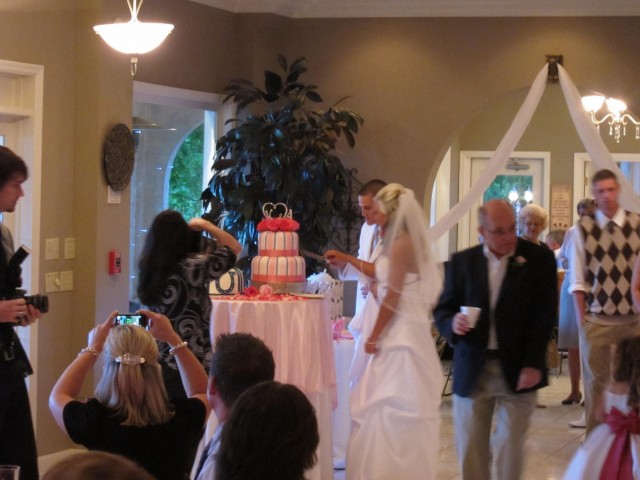 Cutting into wedding cake