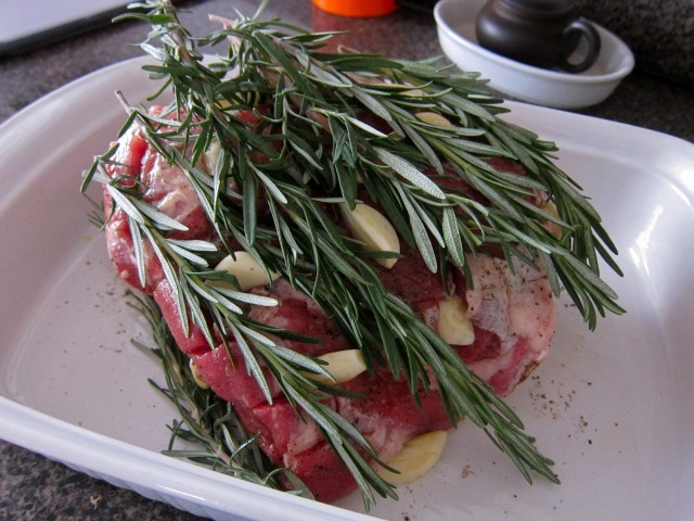 Stuff garlic into sliced lamb