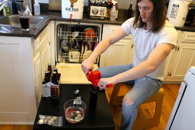 Jeff capping the beer bottles