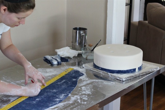 Measuring a strip of fondant